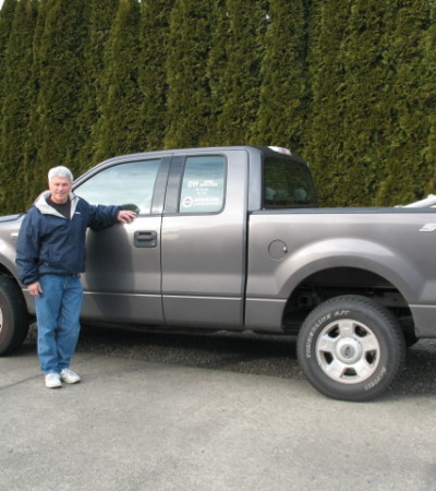 Dan and his truck with ladders and inspection tools.