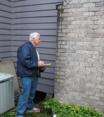 Dan inspecting a home's chimney.
